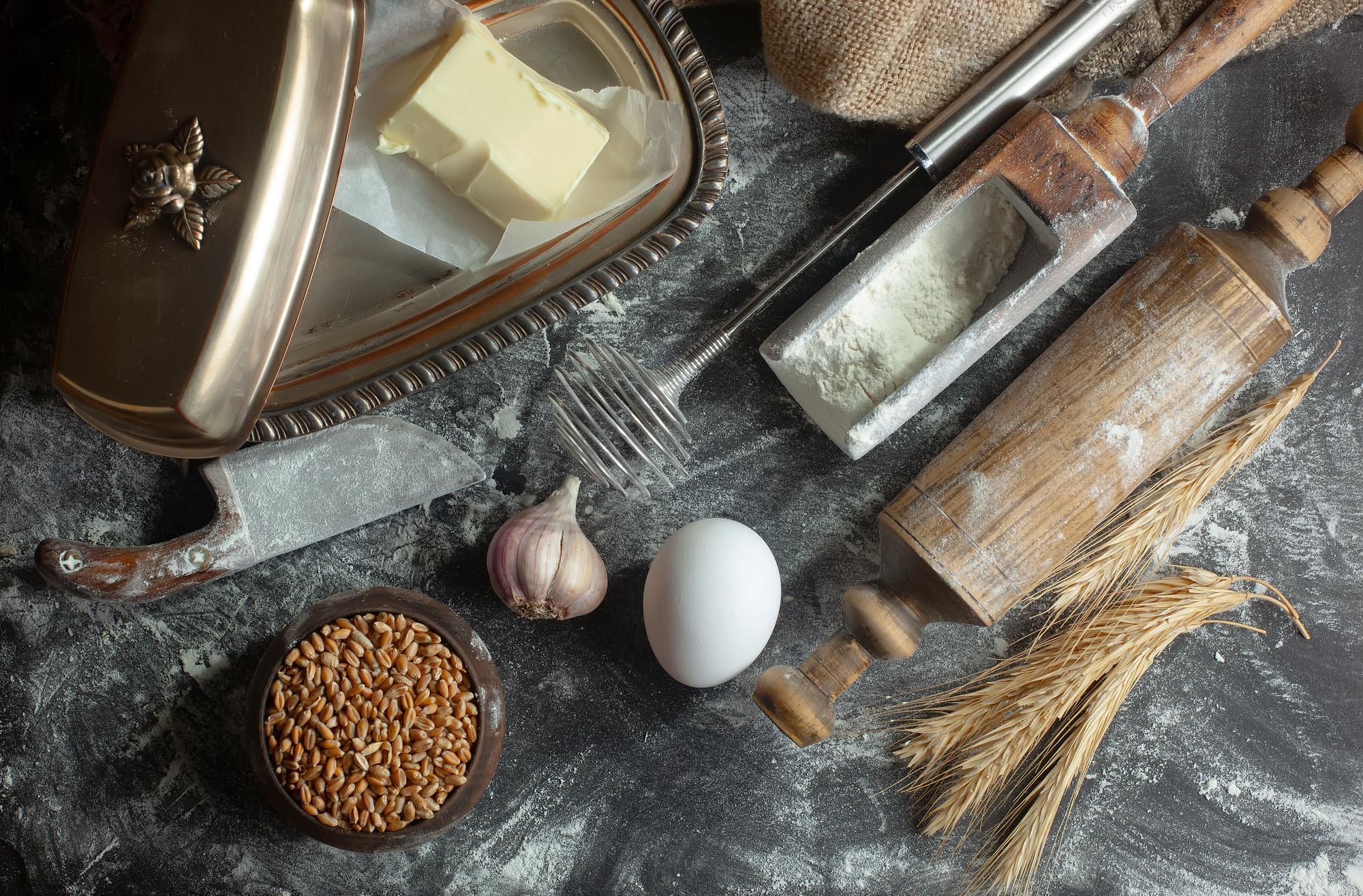 Close-up of crafted sourdough loaf on wooden table